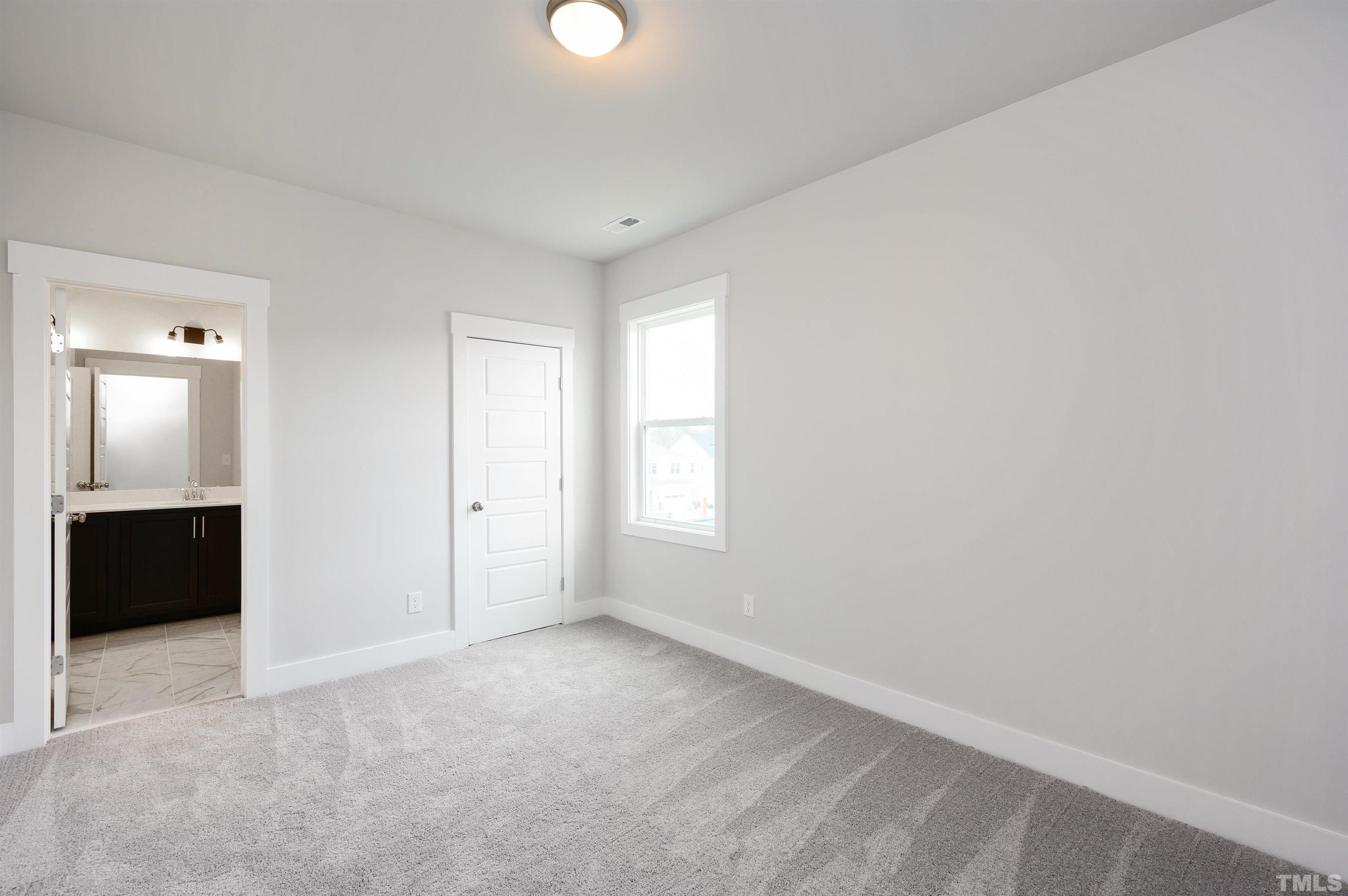 517 Friendship Chapel Road, Unit HVA0055 Wake Forest, NC 27587 - Photo 48 of 58 a view of an empty room with a window