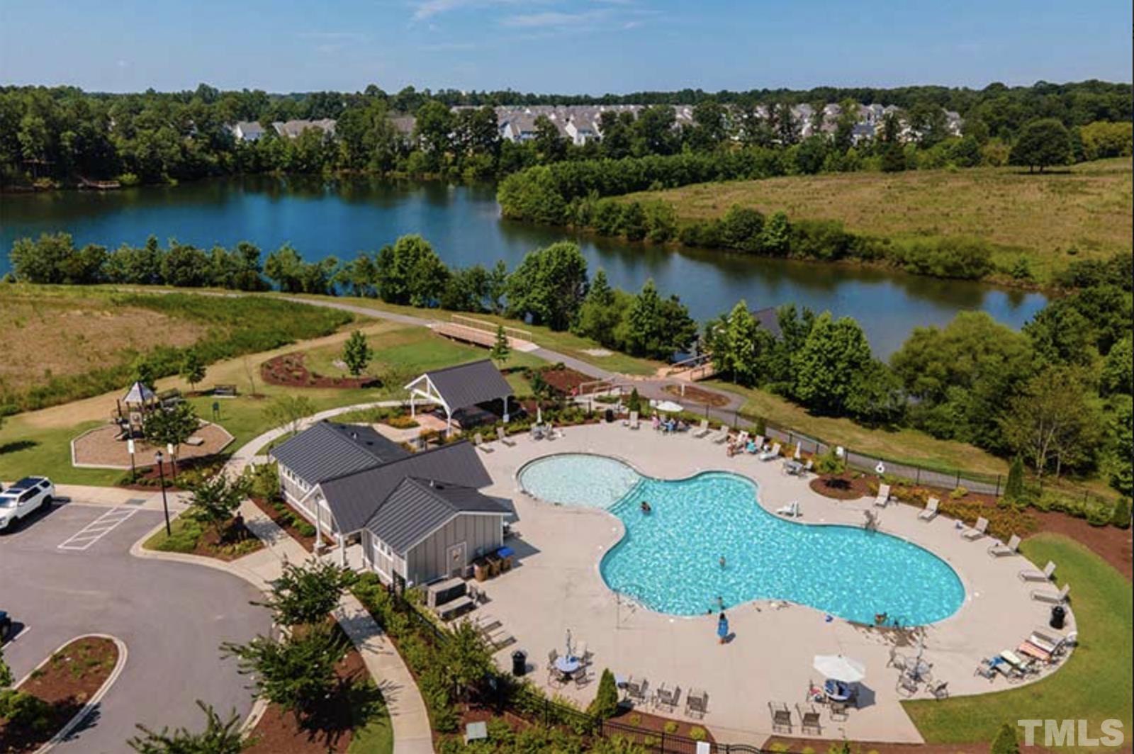 517 Friendship Chapel Road, Unit HVA0055 Wake Forest, NC 27587 - Photo 56 of 58 an aerial view of residential houses with outdoor space and lake view