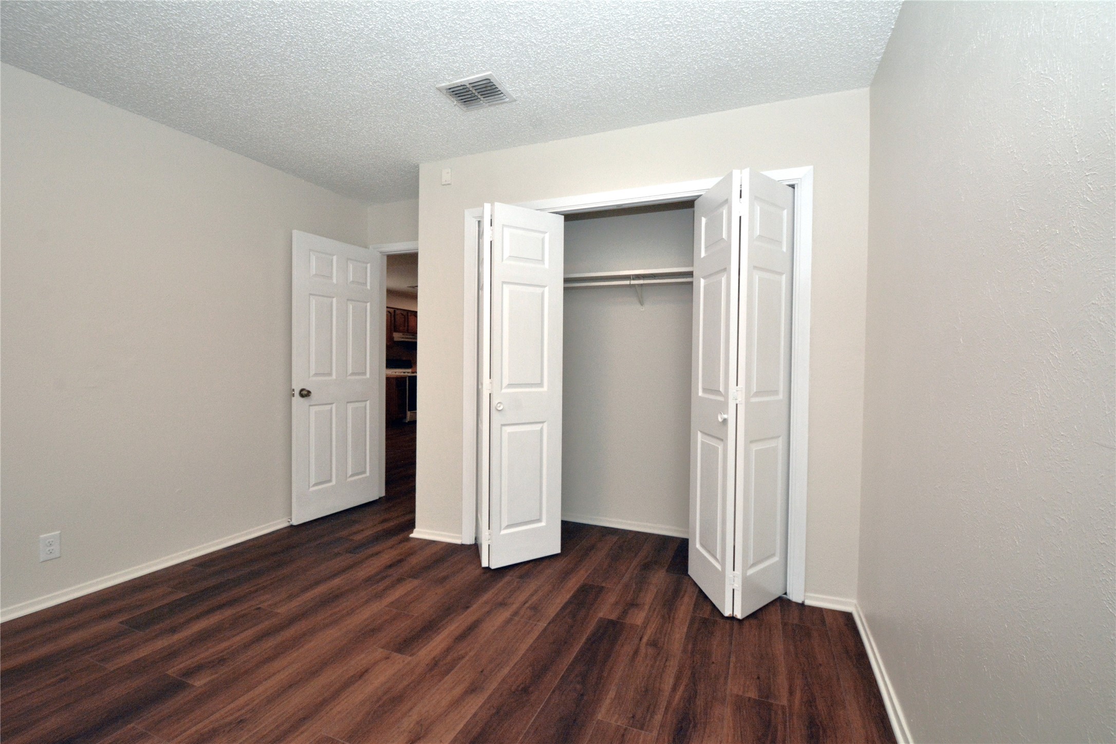 11314 Walnut Ridge Drive, Unit B Austin, TX 78753 - Photo 14 of 19 Rich hardwood-style flooring extends through this comfortable and versatile bedroom space.