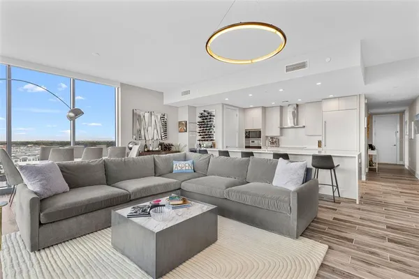 a living room with furniture and a large window