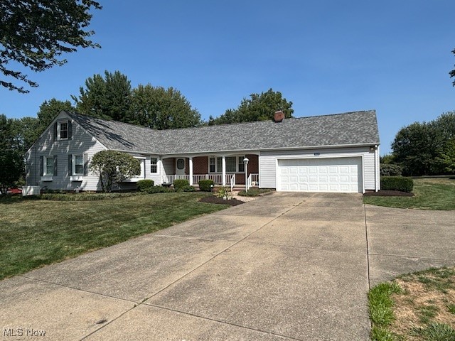 3620 Rambo Avenue Alliance, OH 44601 - Photo 1 of 14 Ranch-style home featuring covered porch, a garage, and a front yard