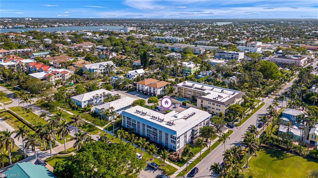 1021 3rd Street South, Unit 110 Naples, FL 34102 - Photo 28 of 30 an aerial view of a city with lots of residential buildings