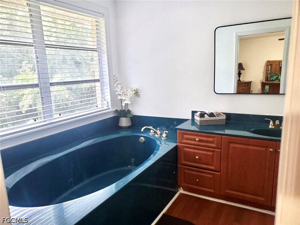 740 19th Street Southwest Naples, FL 34117 - Photo 26 of 35 a bathroom with a bathtub and a sink
