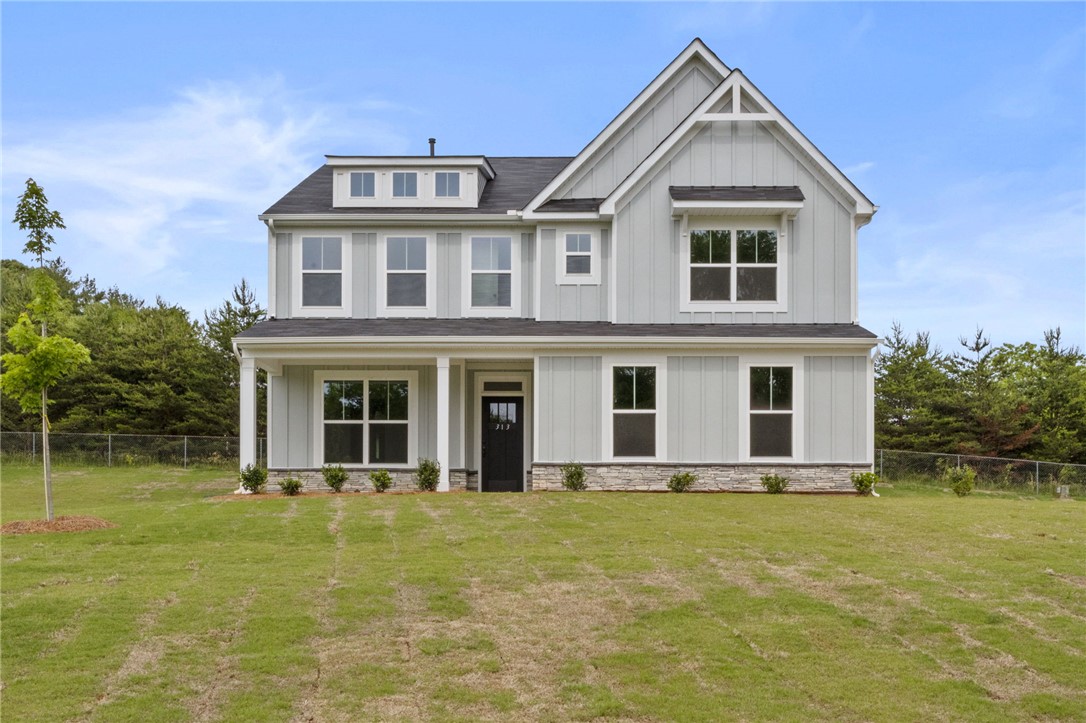 313 Old Shirley Road Central, SC 29630 - Photo 1 of 30 This charming residence showcases board and batten siding, a prominent gable, and a welcoming front porch.