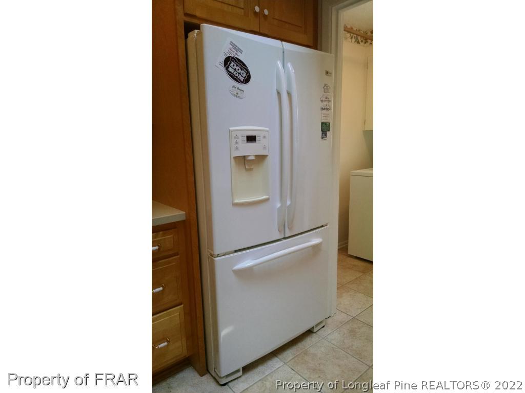 166 Boiling Spring Circle Southern Pines, NC 28387 - Photo 11 of 19 a picture of a room with a door open and a microwave