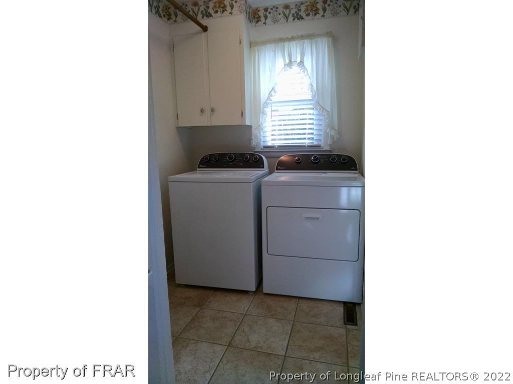 166 Boiling Spring Circle Southern Pines, NC 28387 - Photo 15 of 19 a utility room with dryer and washer