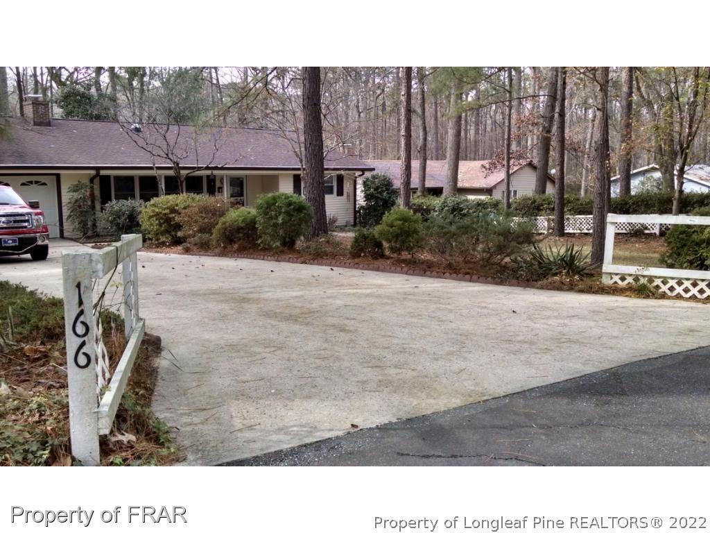 166 Boiling Spring Circle Southern Pines, NC 28387 - Photo 18 of 19 a black and white photo of a house