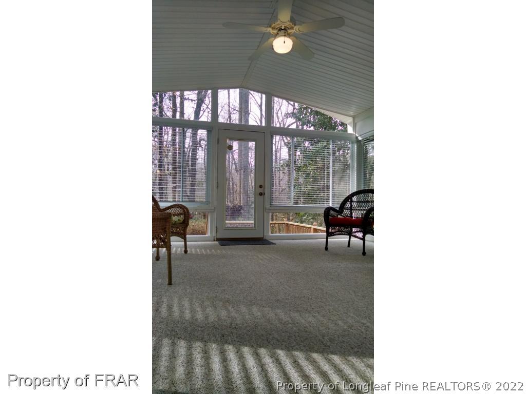 166 Boiling Spring Circle Southern Pines, NC 28387 - Photo 10 of 19 a living room with furniture and a large window