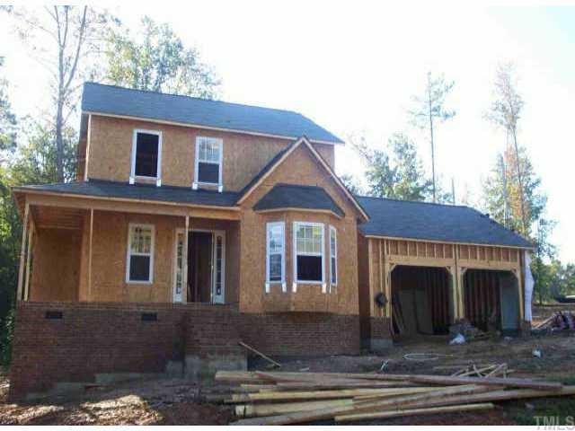 8409 Ridgebury Road Raleigh, NC 27603 - Photo 1 of 1 a front view of a house with yard