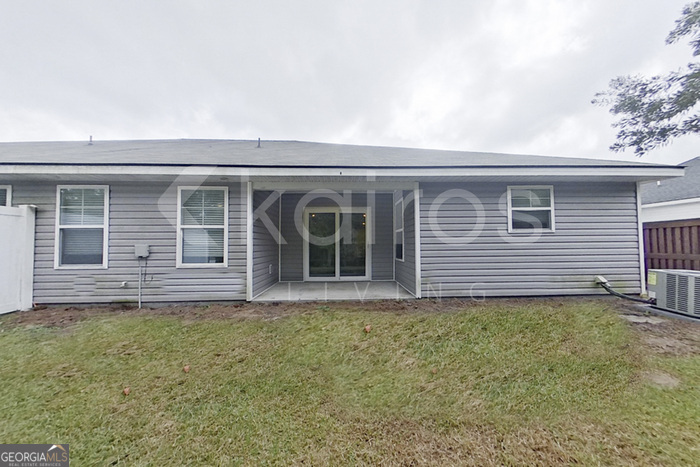 132 Cottage Grove Road Brunswick, GA 31525 - Photo 15 of 17 front view of a house with a yard