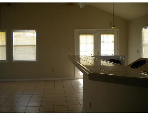 a kitchen with a sink cabinets and a window