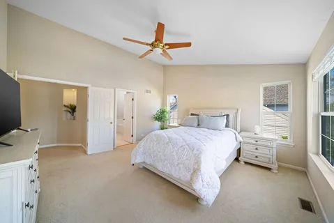 a bedroom with a bed and a flat tv screen