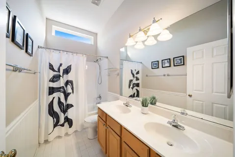 a bathroom with a sink a mirror and a light fixture