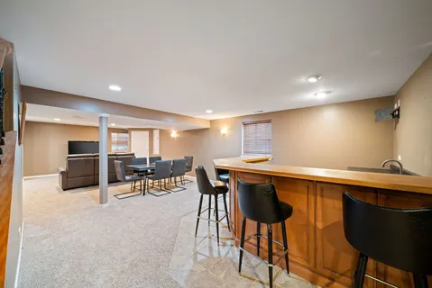 a kitchen with a table and chairs in it