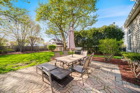 a view of yard with seating area and green space