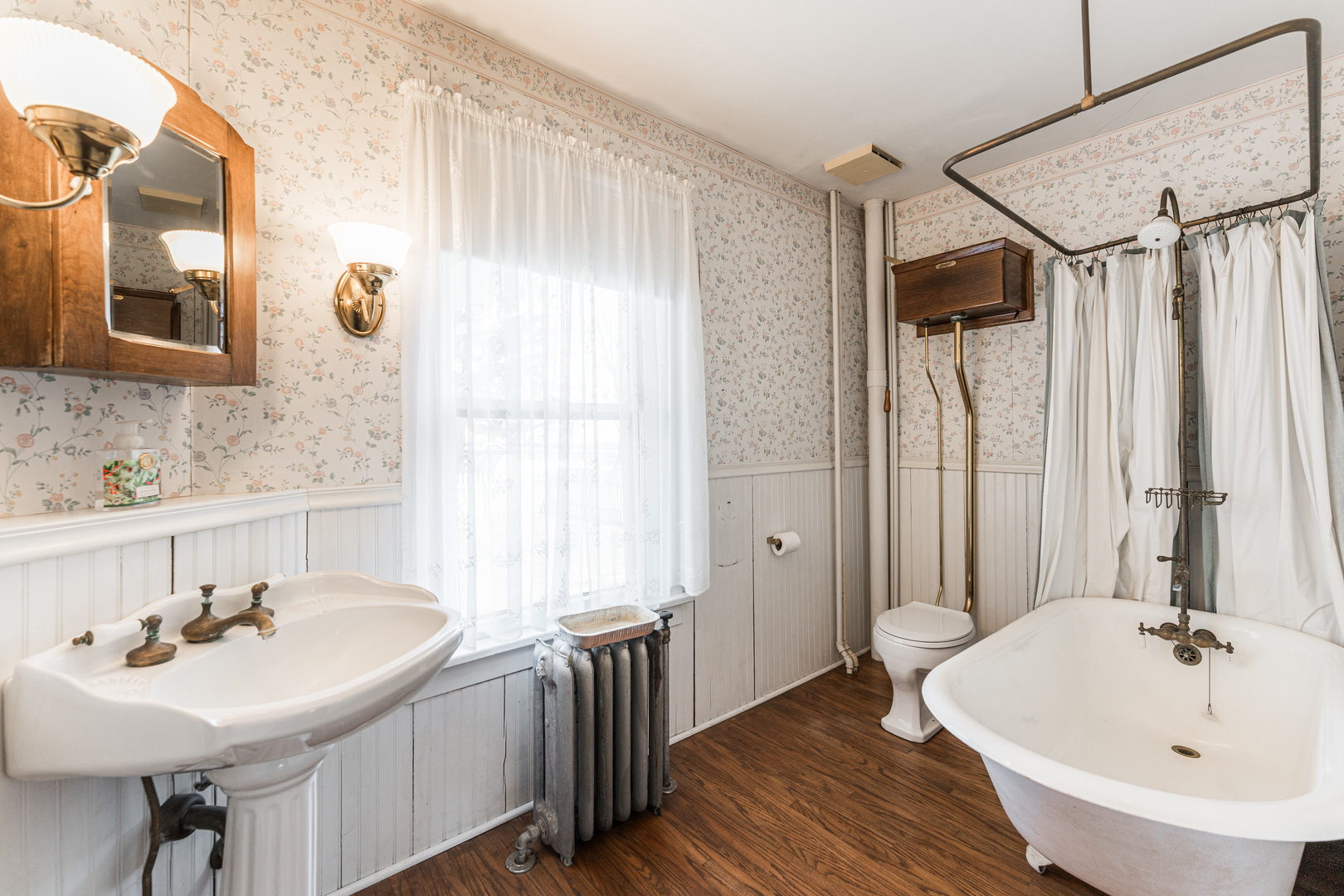 23659 Malta Road Malta, IL 60150 - Photo 23 of 111 a bathroom with a sink a mirror and a bathtub