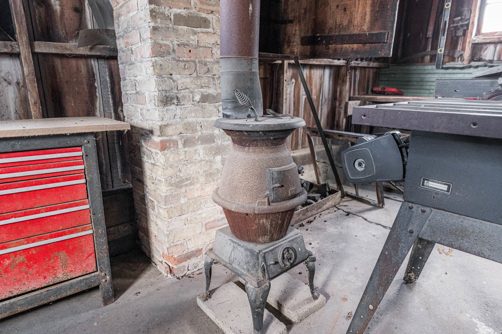 23659 Malta Road Malta, IL 60150 - Photo 45 of 111 a room with water heater and wooden walls