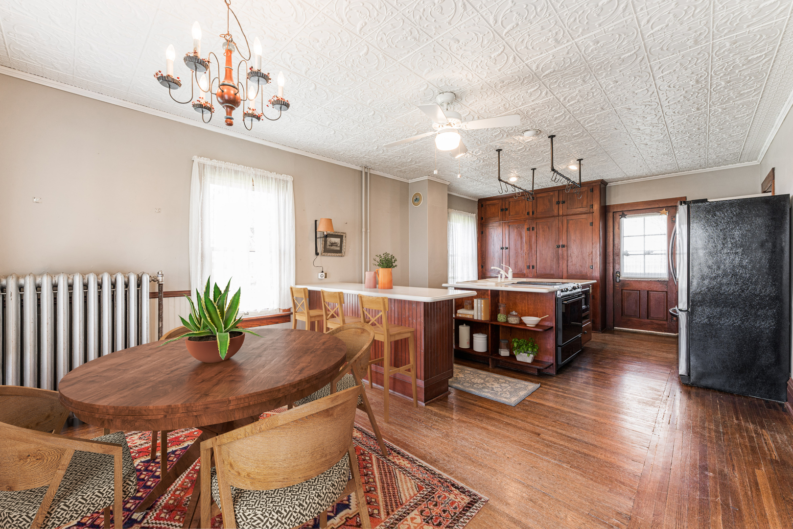 23659 Malta Road Malta, IL 60150 - Photo 9 of 111 a kitchen with a table chairs refrigerator and cabinets