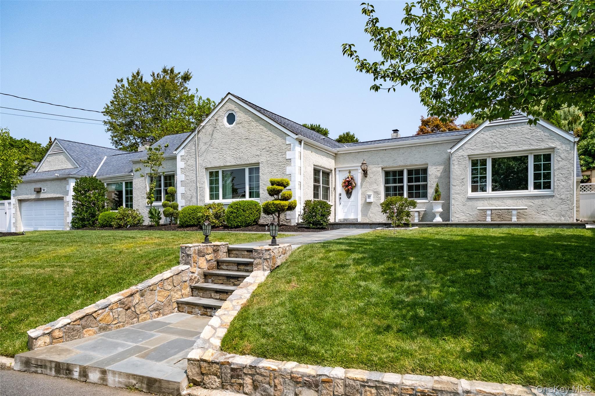 a front view of house with yard and green space