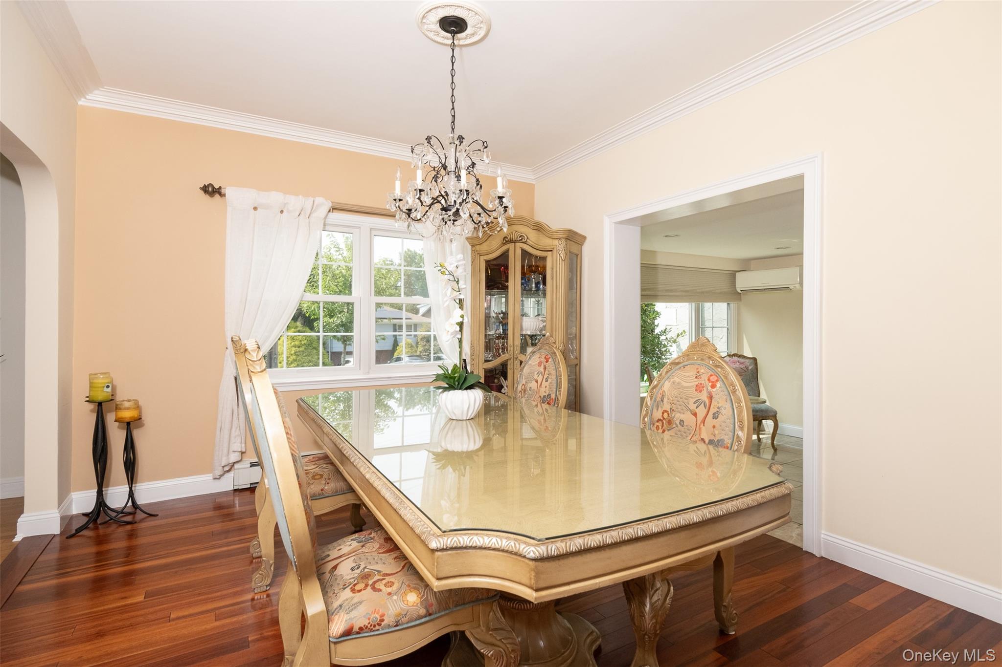 982 Split Rock Road Pelham, NY 10803 - Photo 13 of 33 a view of a dining room with furniture and wooden floor