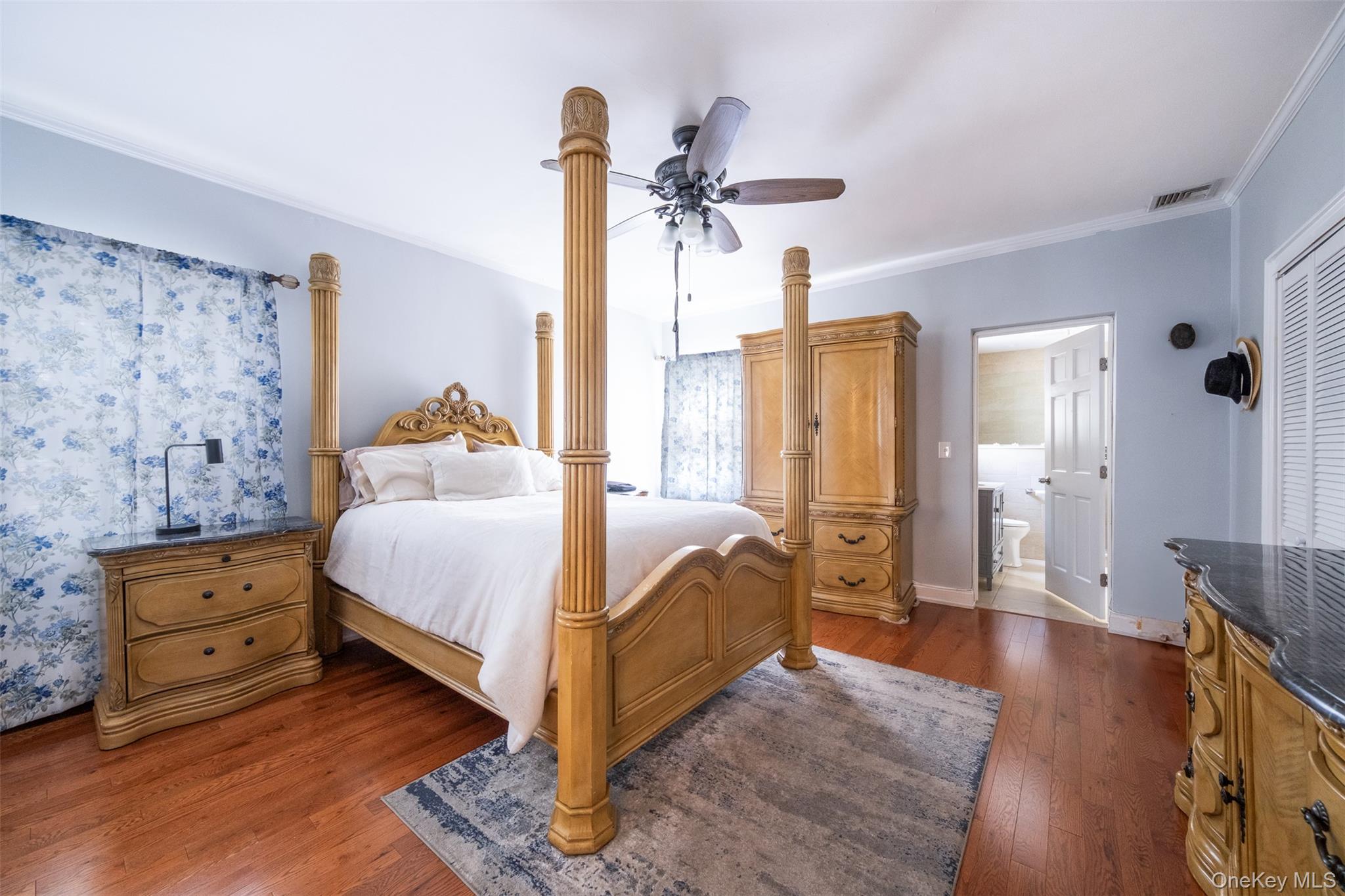 982 Split Rock Road Pelham, NY 10803 - Photo 16 of 33 a bed room with a bed and a dresser