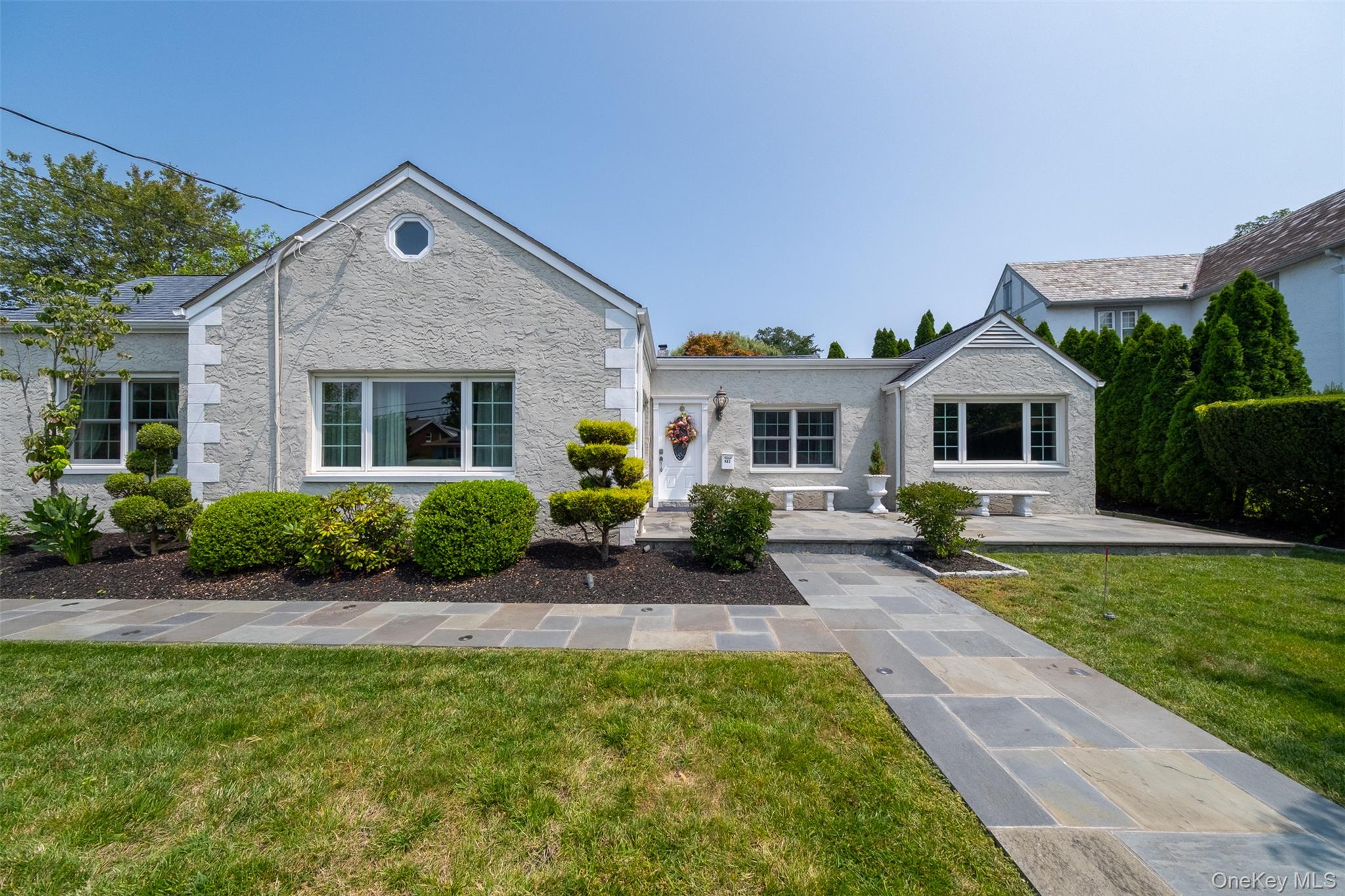 982 Split Rock Road Pelham, NY 10803 - Photo 28 of 33 a front view of house with yard and green space
