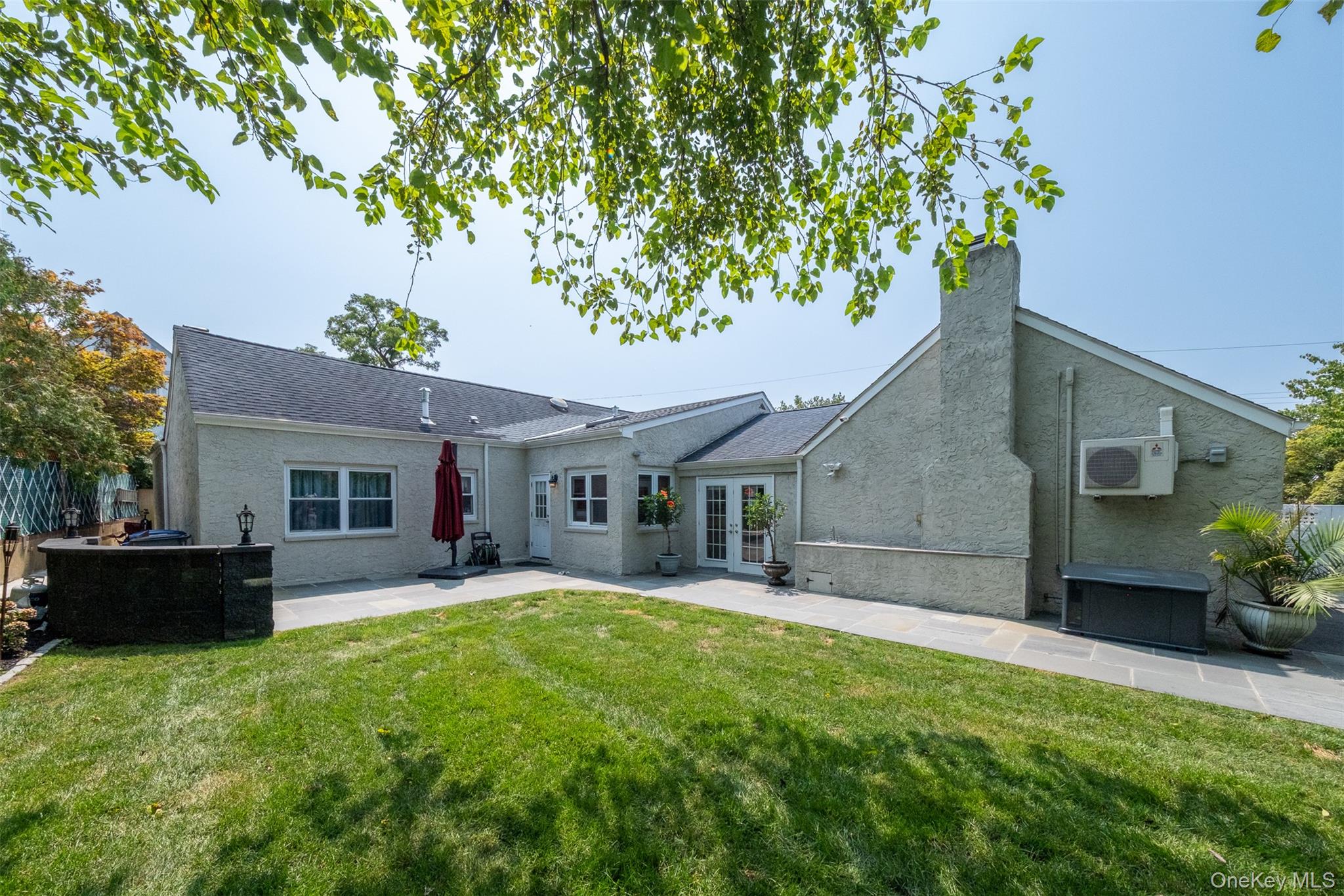 982 Split Rock Road Pelham, NY 10803 - Photo 29 of 33 a front view of house with yard and green space