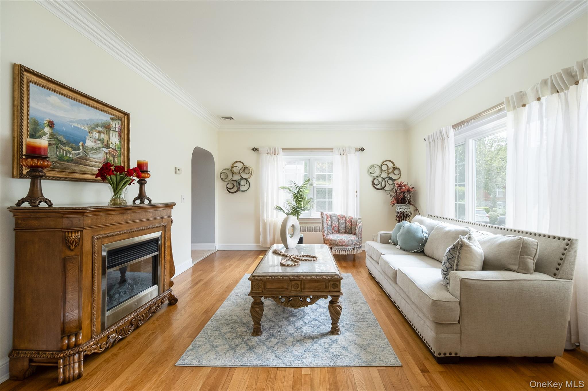 982 Split Rock Road Pelham, NY 10803 - Photo 3 of 33 a living room with furniture and a fireplace