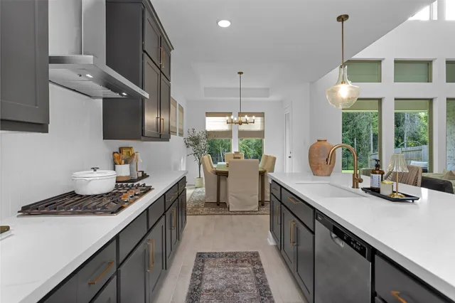 a kitchen with a sink stove and cabinets