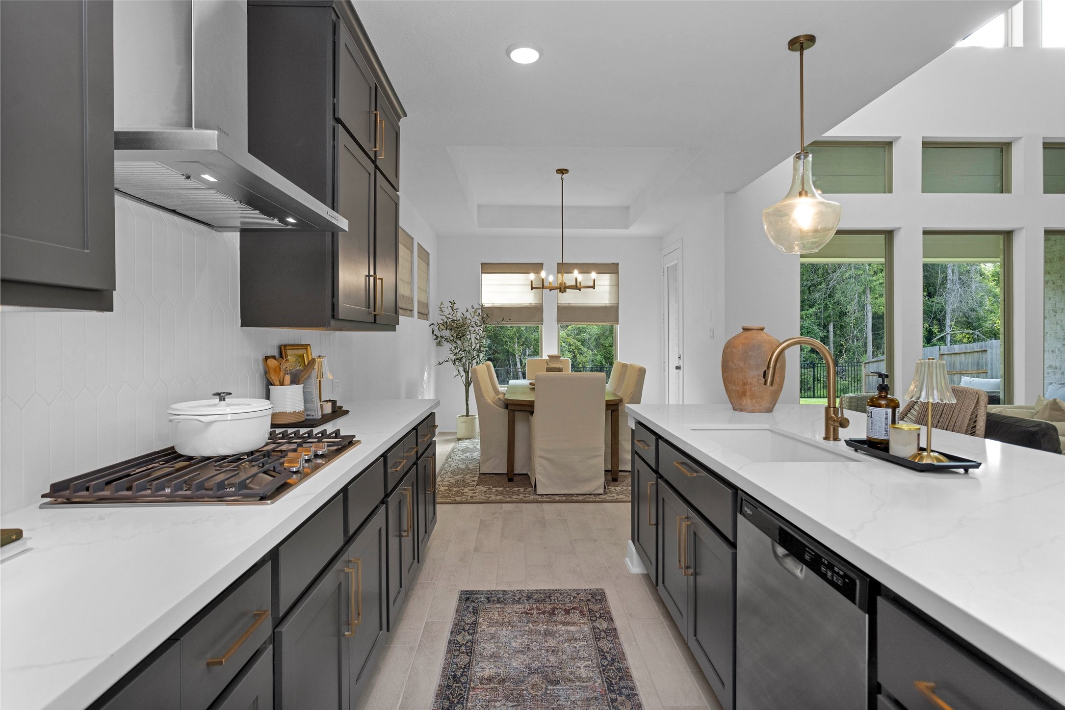 108 Stephens Rdg Lane Montgomery, TX 77316 - Photo 23 of 50 a kitchen with a sink stove and cabinets