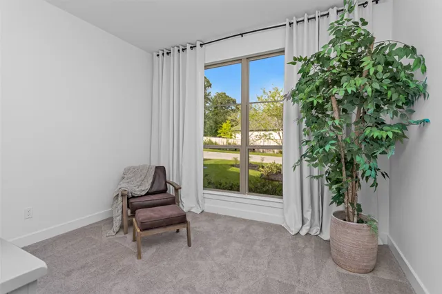 a bathroom with a sink vanity mirror and toilet