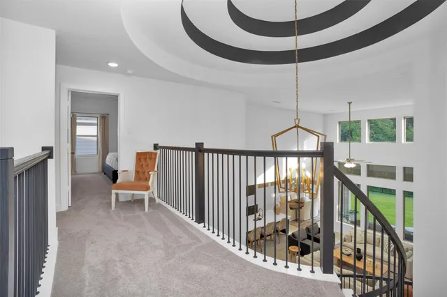 a bedroom with a bed and a ceiling fan