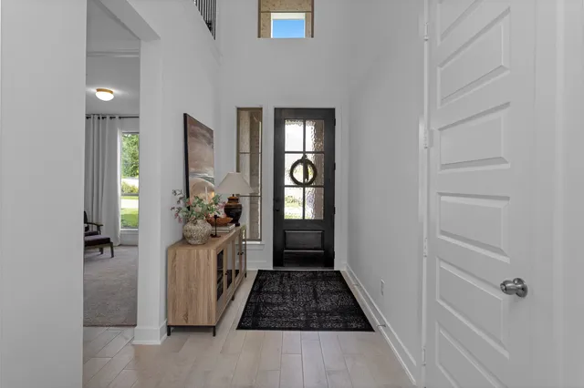 a view of a hallway view with wooden floor and staircase