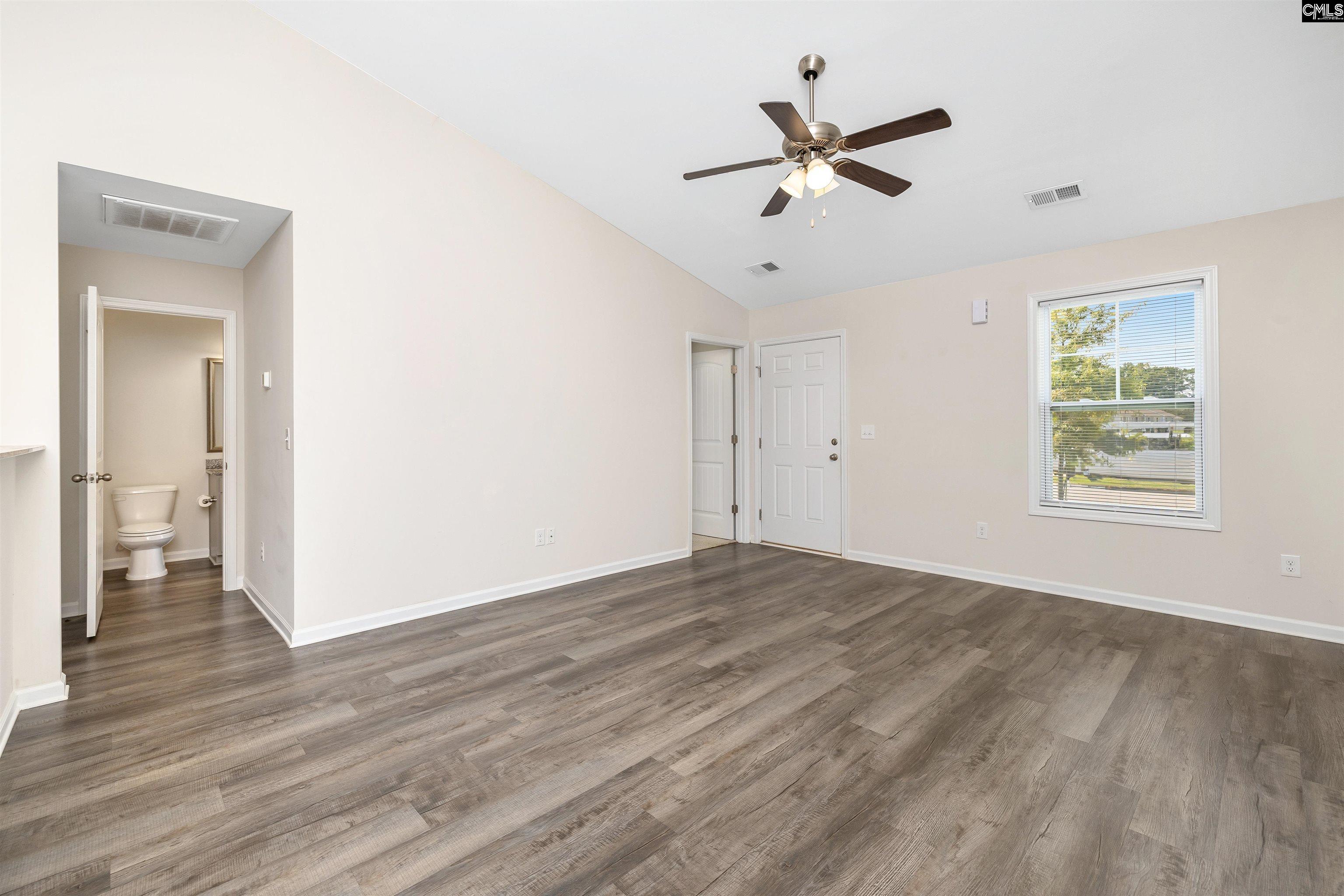 2157 Still Pointe Drive Sumter, SC 29154 - Photo 4 of 25 a view of a livingroom with a ceiling fan and wooden floor