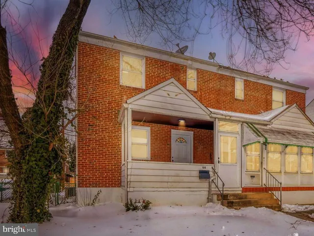 a front view of a house with a garage