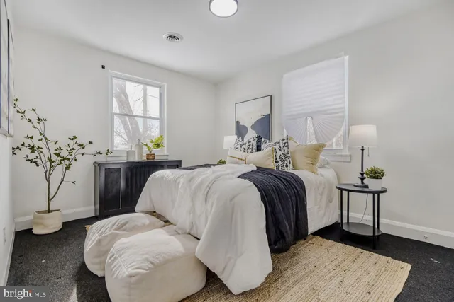 a bedroom with a bed and window