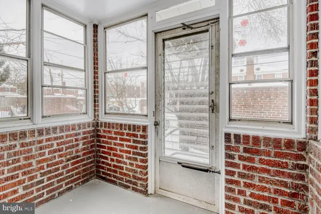 a view of empty room with windows