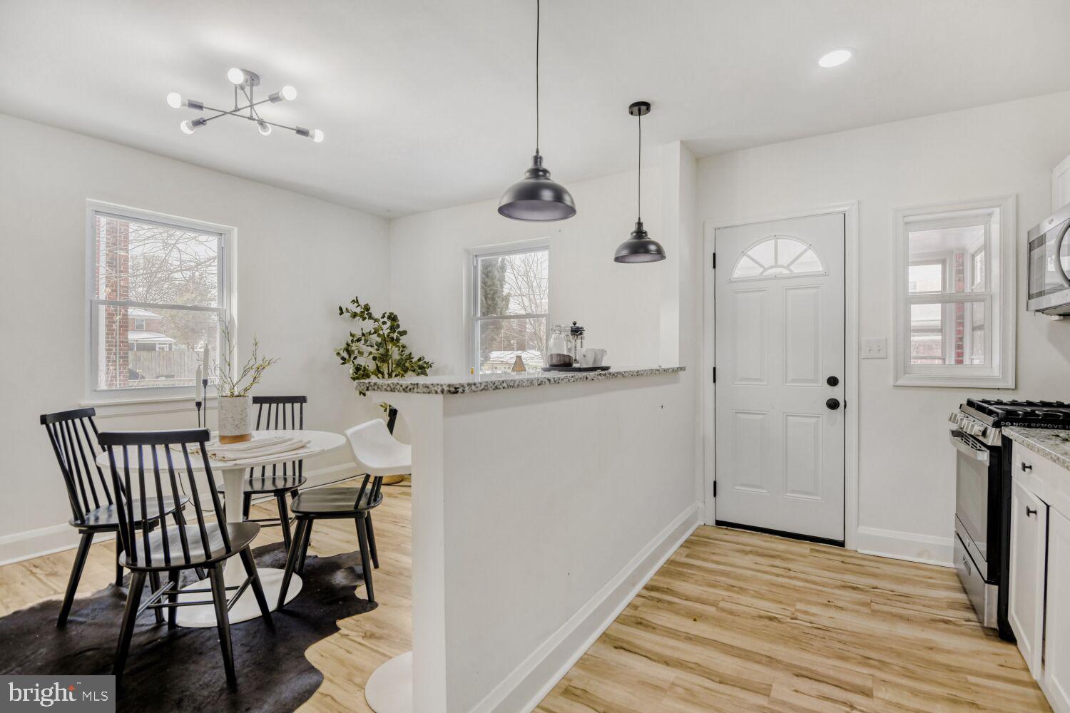 100 Shipway Dundalk, MD 21222 - Photo 10 of 28 a view of a dining room with furniture window and wooden floor