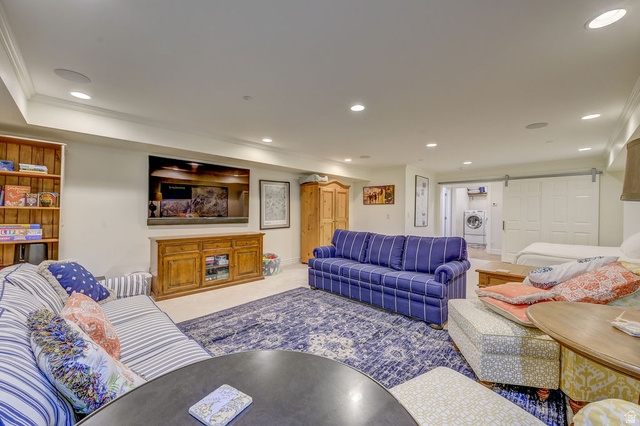 9699 Bypass Road, Unit 5 Alta, UT 84092 - Photo 11 of 54 Spacious open-concept room featuring recessed lighting, a built-in wood bookshelf, wood-finish media console, and a ceiling-mounted sound system