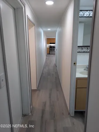 a view of gallery with wooden floor