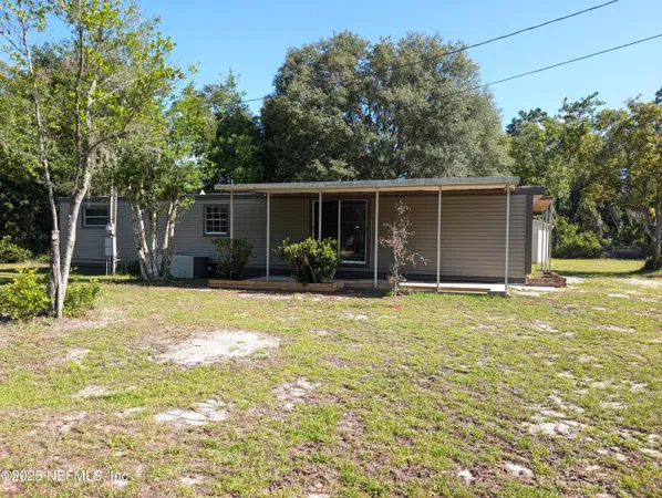 a front view of house with garage