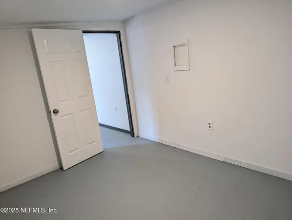an empty room with a door