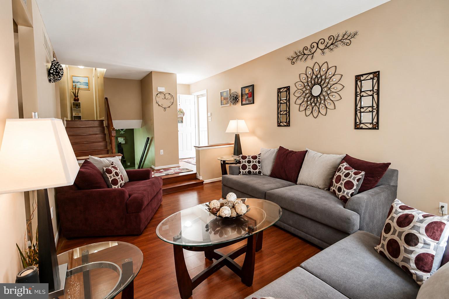 8121 Elizabeth Road Pasadena, MD 21122 - Photo 6 of 27 a living room with furniture and wooden floor