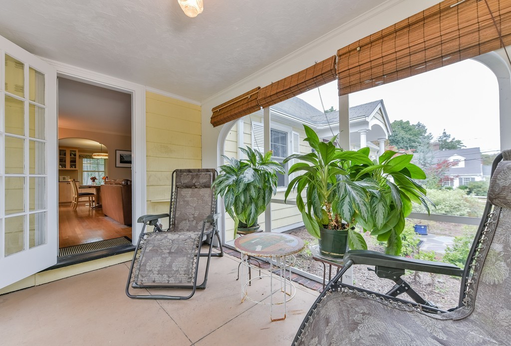 74 Puritan Road Newton, MA 02468 - Photo 12 of 25 a dining room with furniture and a potted plant