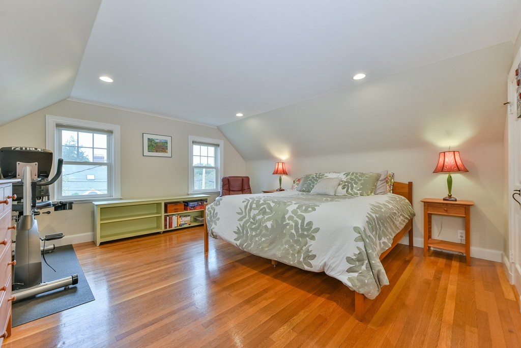 74 Puritan Road Newton, MA 02468 - Photo 15 of 25 a spacious bedroom with a bed and wooden floor