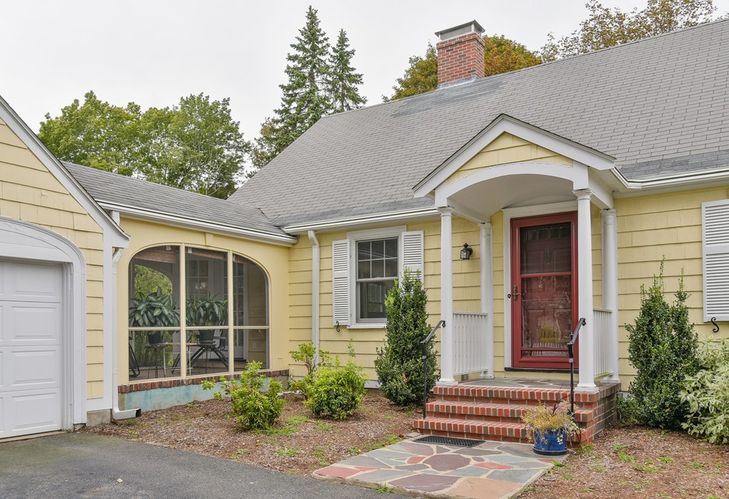 74 Puritan Road Newton, MA 02468 - Photo 17 of 25 a front view of a house with a yard