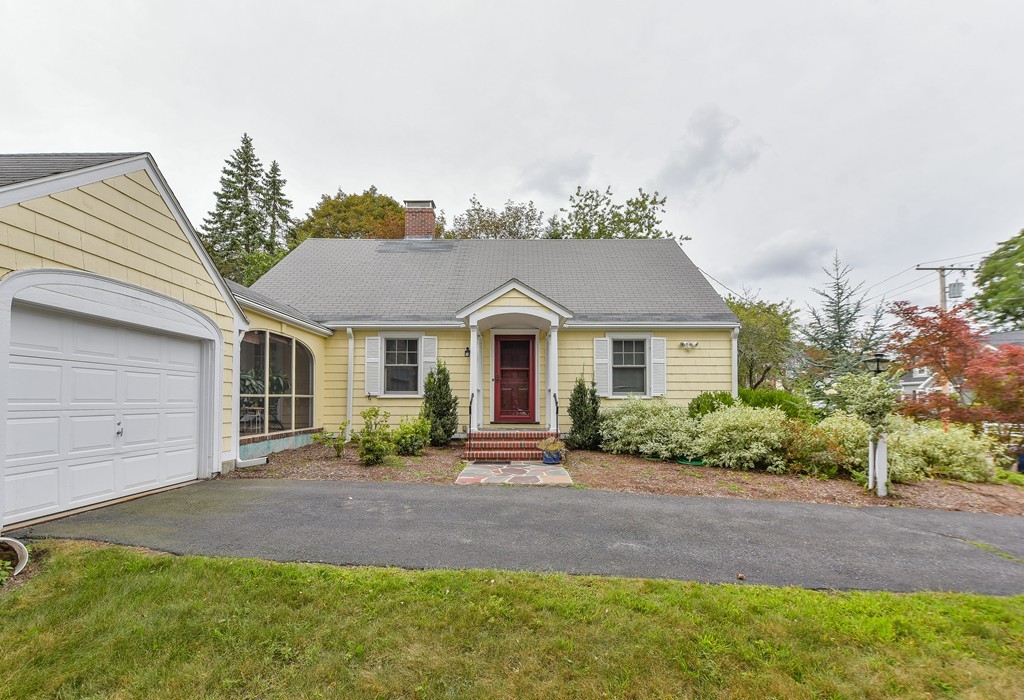 74 Puritan Road Newton, MA 02468 - Photo 18 of 25 a front view of a house with garden