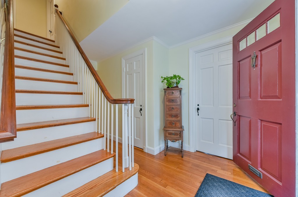 74 Puritan Road Newton, MA 02468 - Photo 2 of 25 a view of front door with wooden floor and stairs