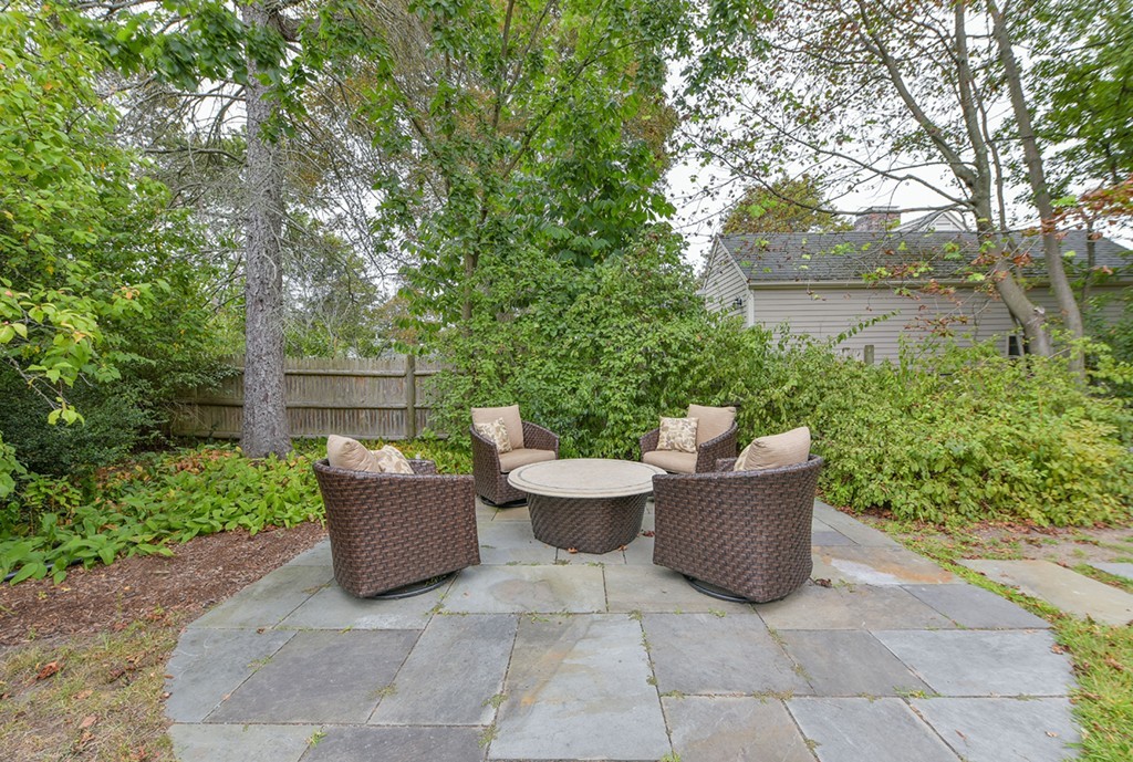 74 Puritan Road Newton, MA 02468 - Photo 21 of 25 a view of backyard with outdoor seating and green space