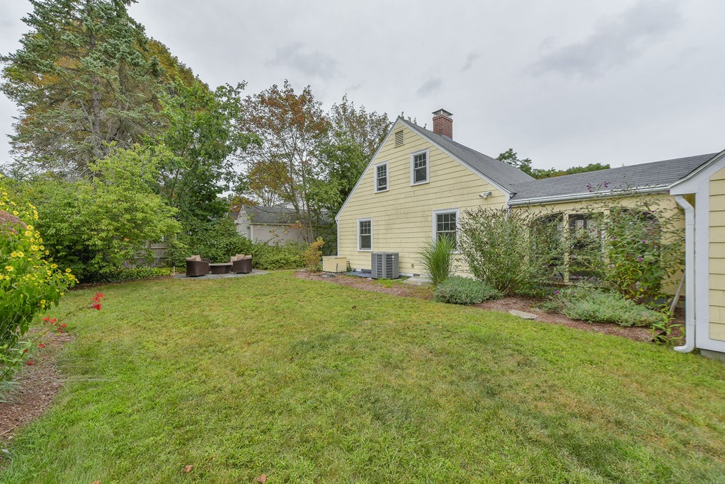 74 Puritan Road Newton, MA 02468 - Photo 23 of 25 a view of a house with backyard and garden